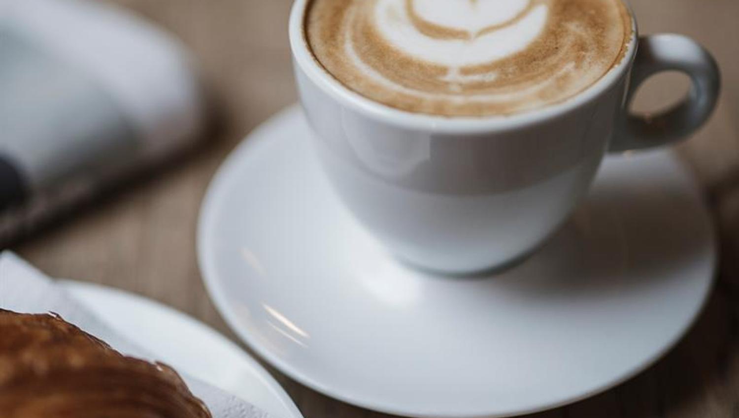 detail image: coffee cup and baked goods