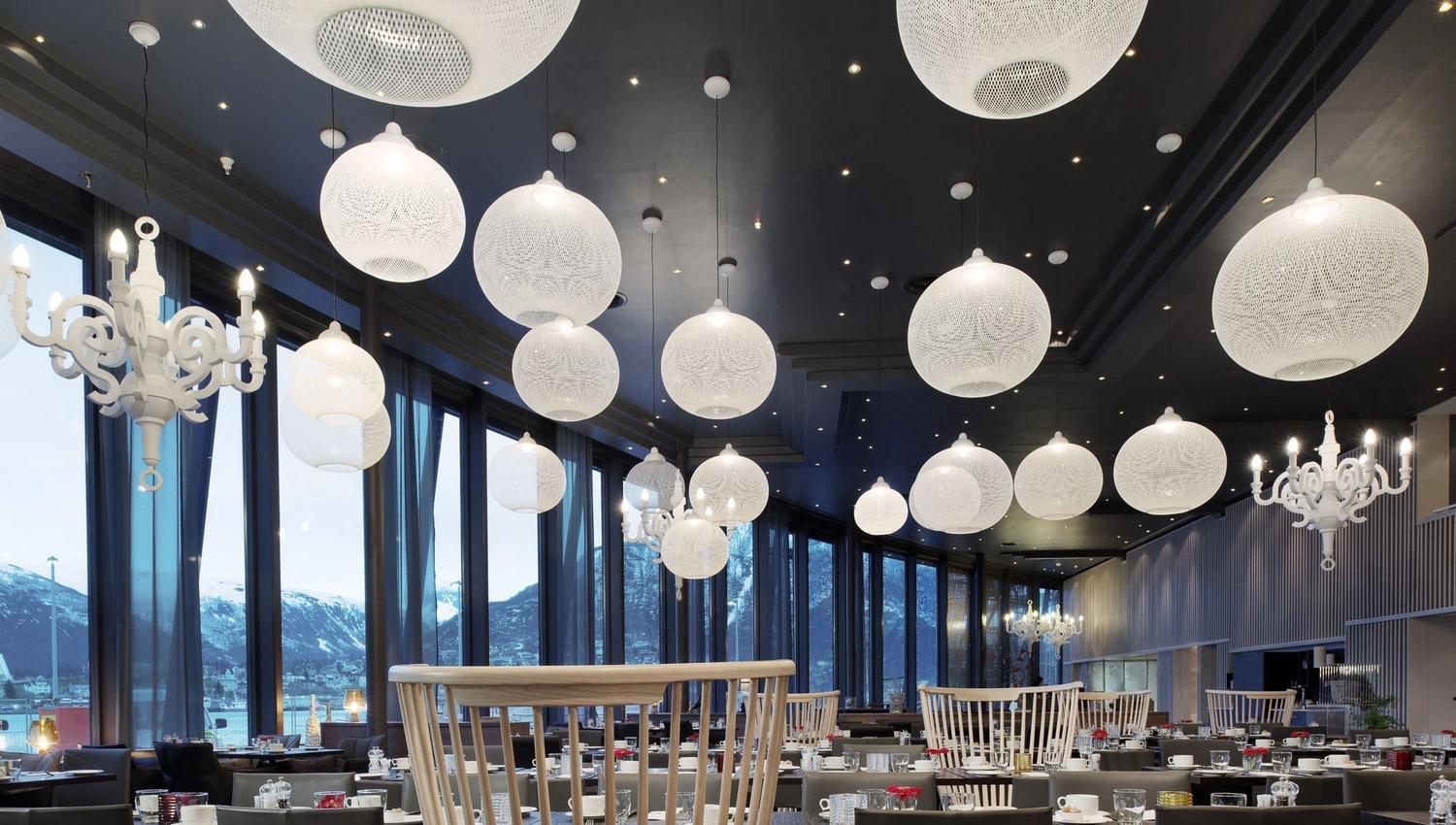 Restaurant with many lamps.