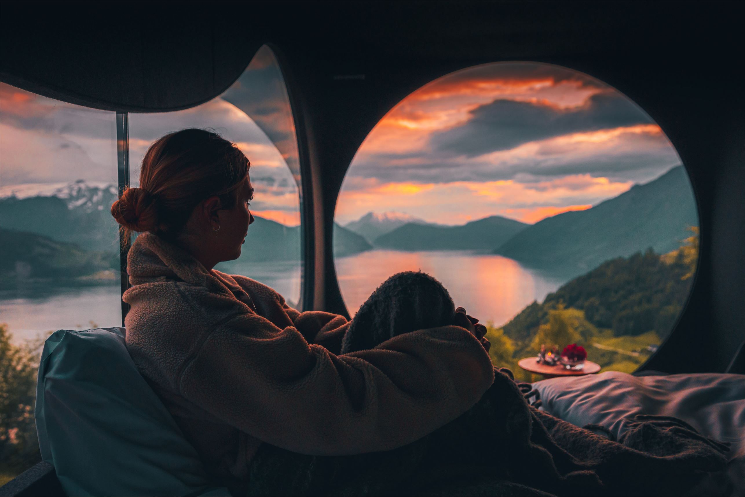 Stunning panoramic view from the Birdbox cabin at Skaara Living on Lotsberg in Nordfjord, surrounded by mountains and fjord landscape.