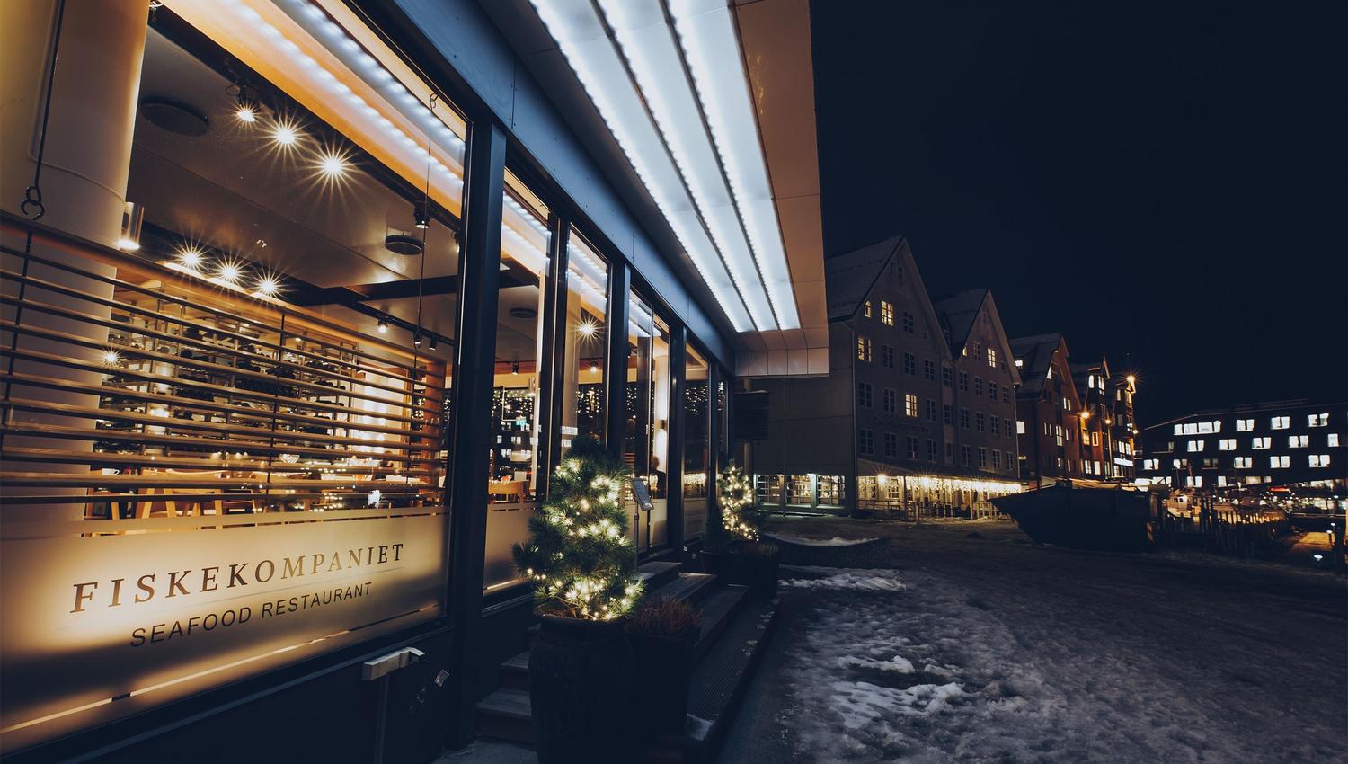 Outside view of the restaurant with the Tromsø city harbour behind