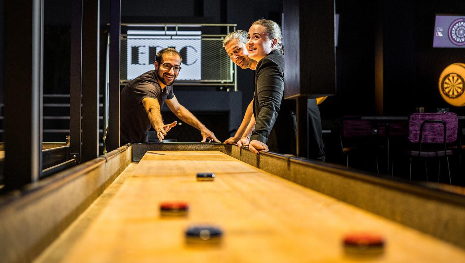 Guests playing shuffleboard at EPIC Tromsø.