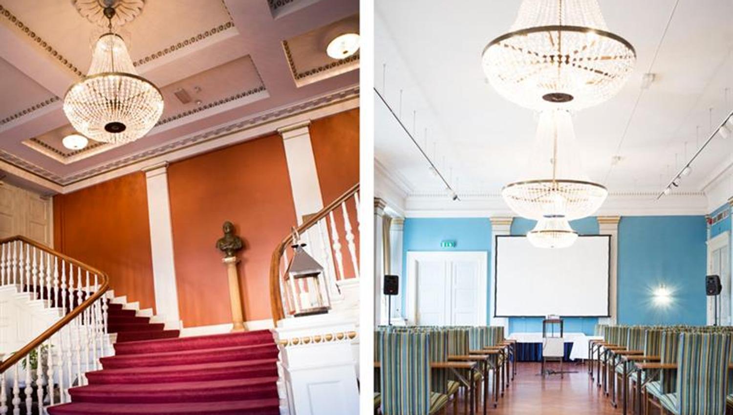 Photo of a staircase with red carpet and chandelier hanging from the ceiling, and a picture of a conference room with chairs and tables, and two chand
