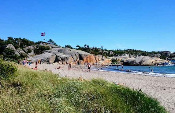Sandy beach, rocky cliffs and sea