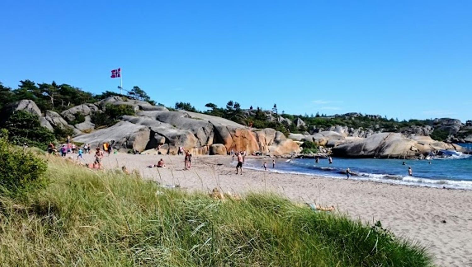 Sandy beach, rocky cliffs and sea