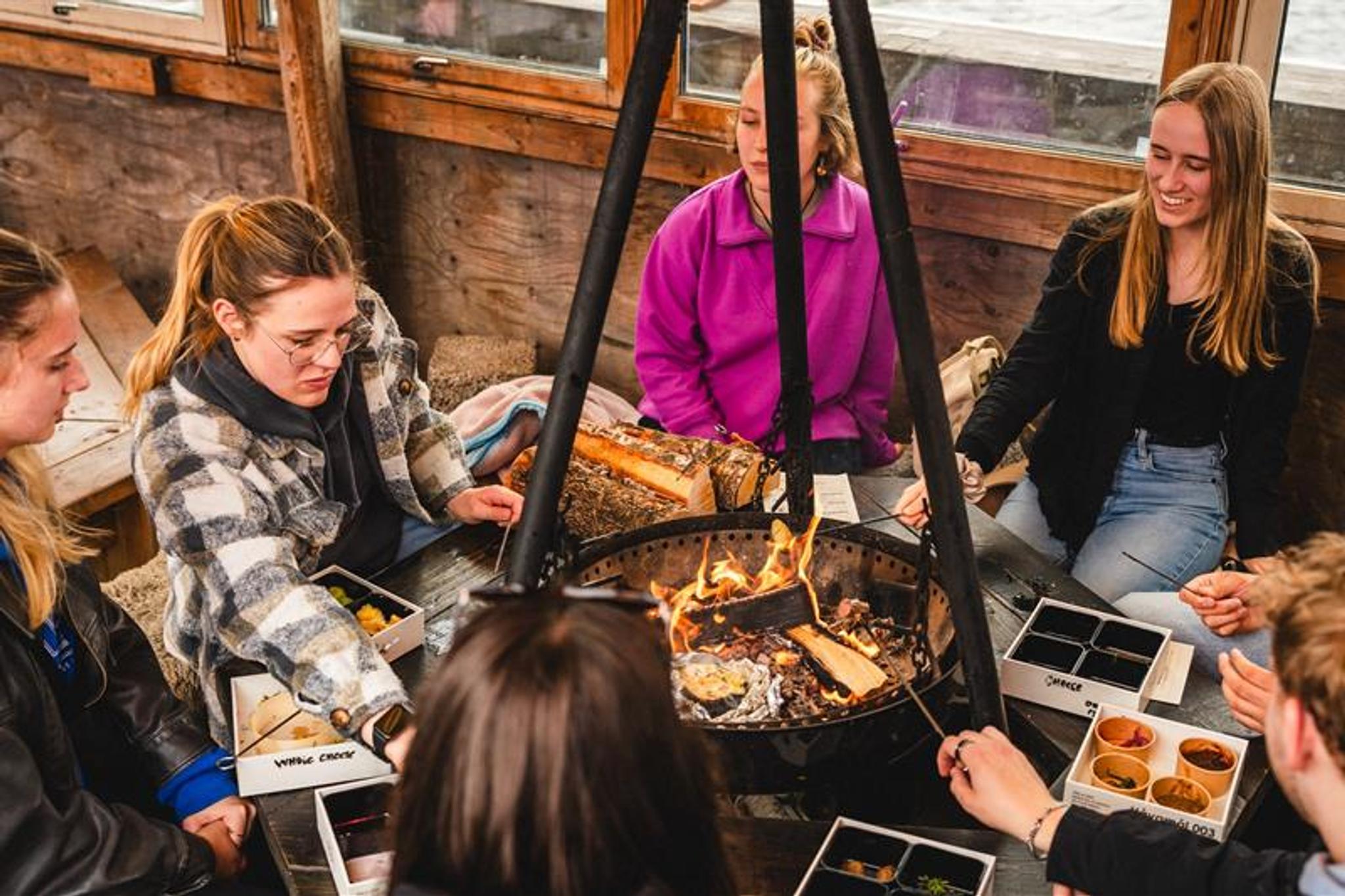 People sitting around the fire pit