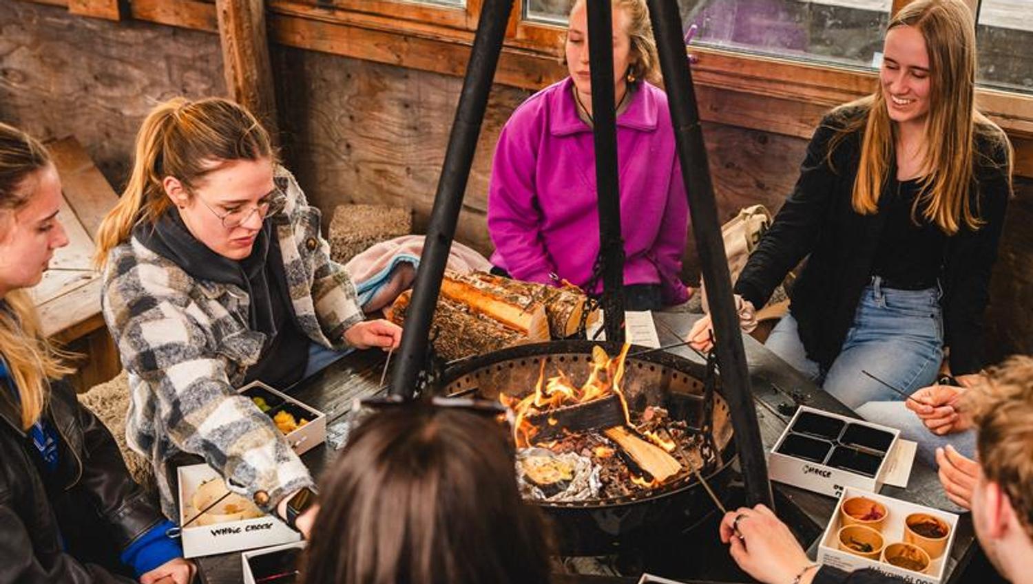 People sitting around the fire pit