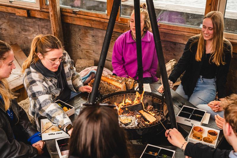 People sitting around the fire pit