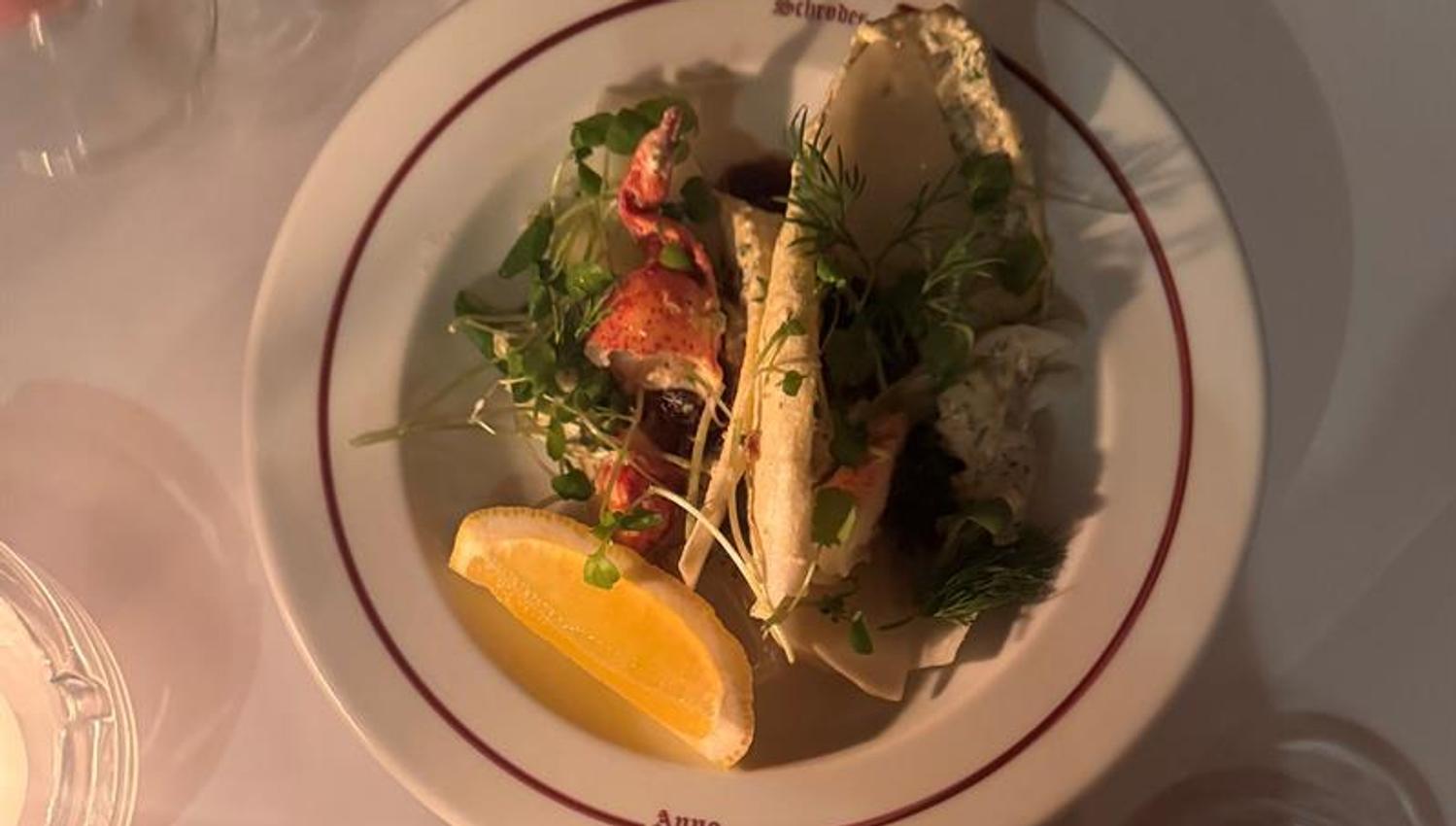 Norwegian seafood dish with herring served on a white plate.