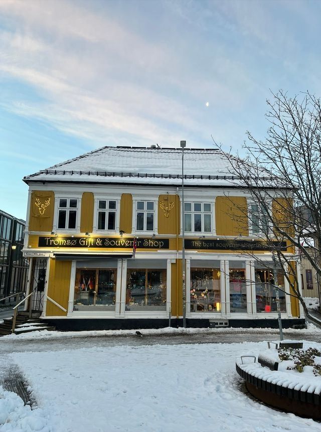 Tromsø Gift & Souvenir Shop surrounded by snow-covered scenery during the winter season.