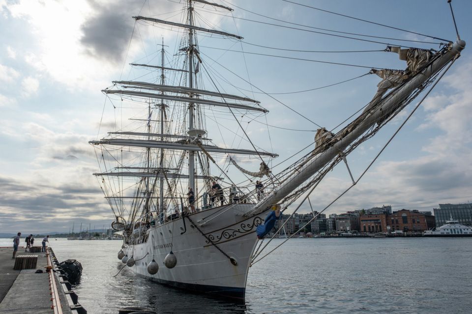 The ship ankered by the pier.