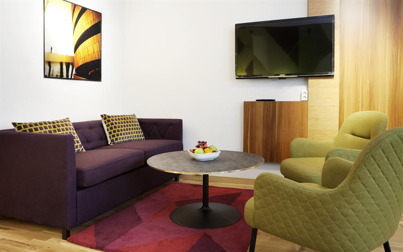 lounge area with a TV