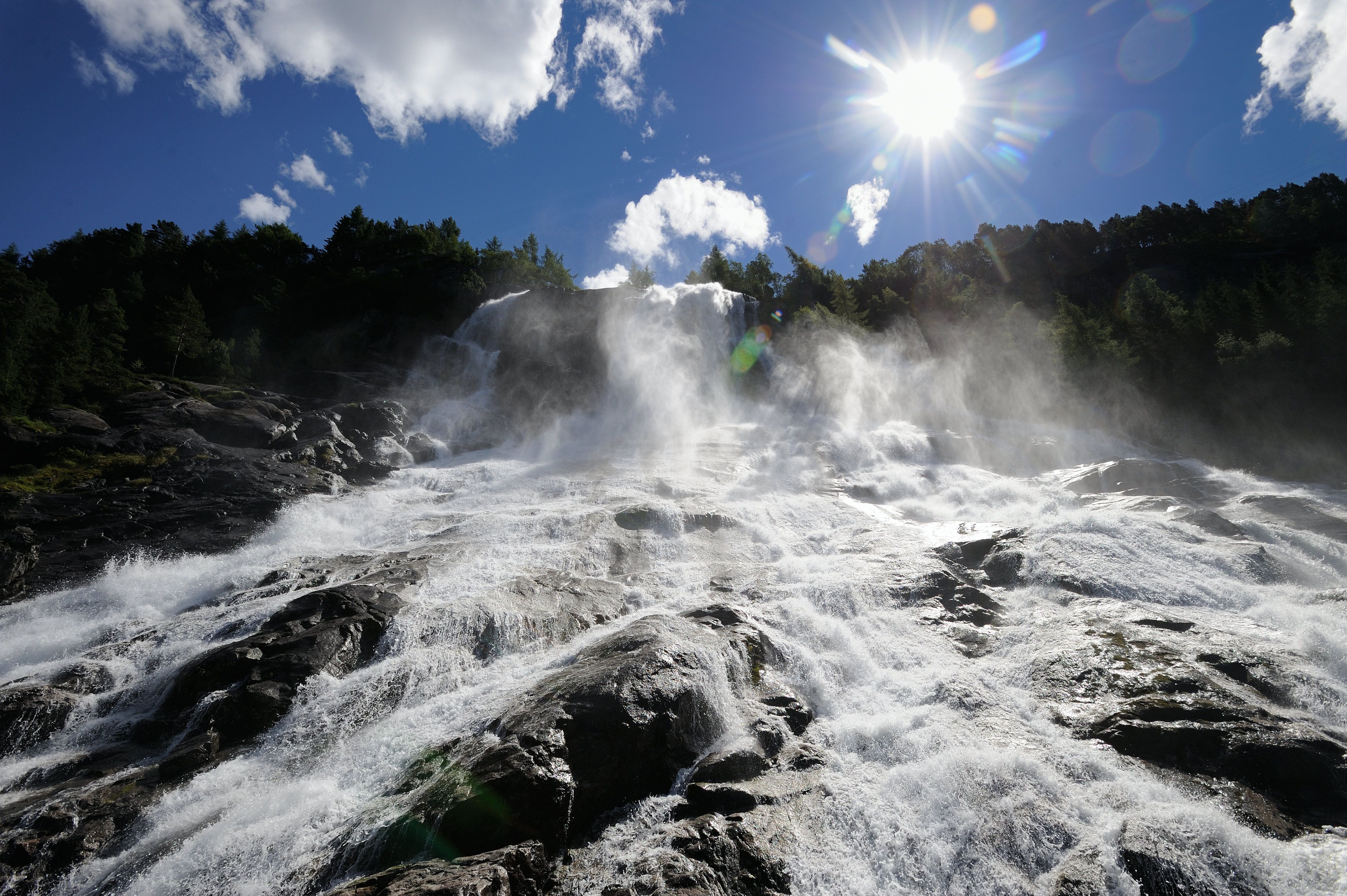 Sunlit Furubergsfossen – A dramatic shot of Furubergsfossen with sunlight breaking through the water, creating a magical atmosphere.