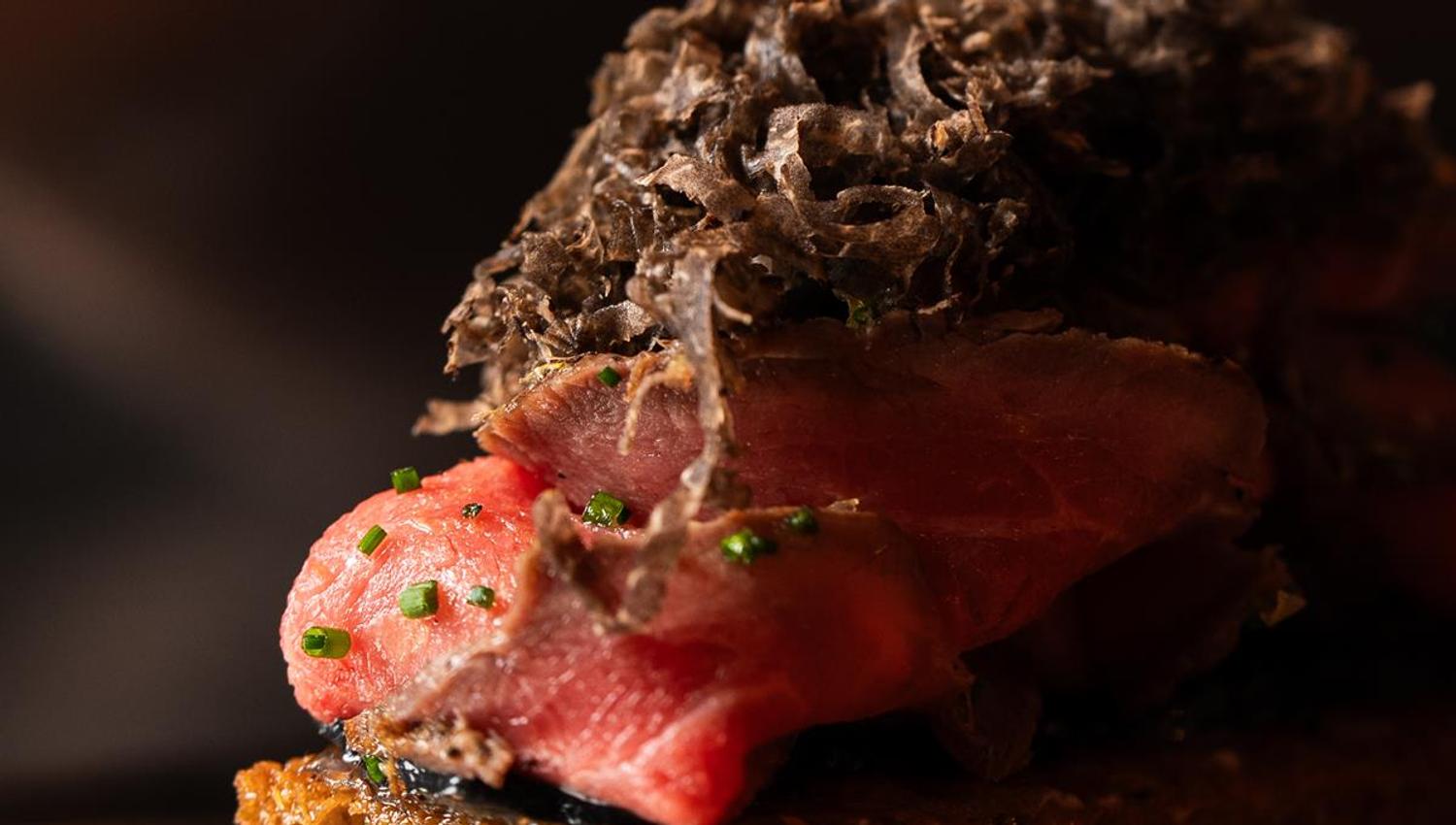Gourmet dish with meat and vegetables.