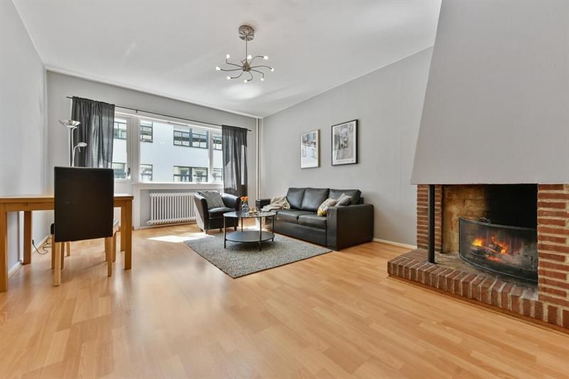 Living room, dining table and open fireplace