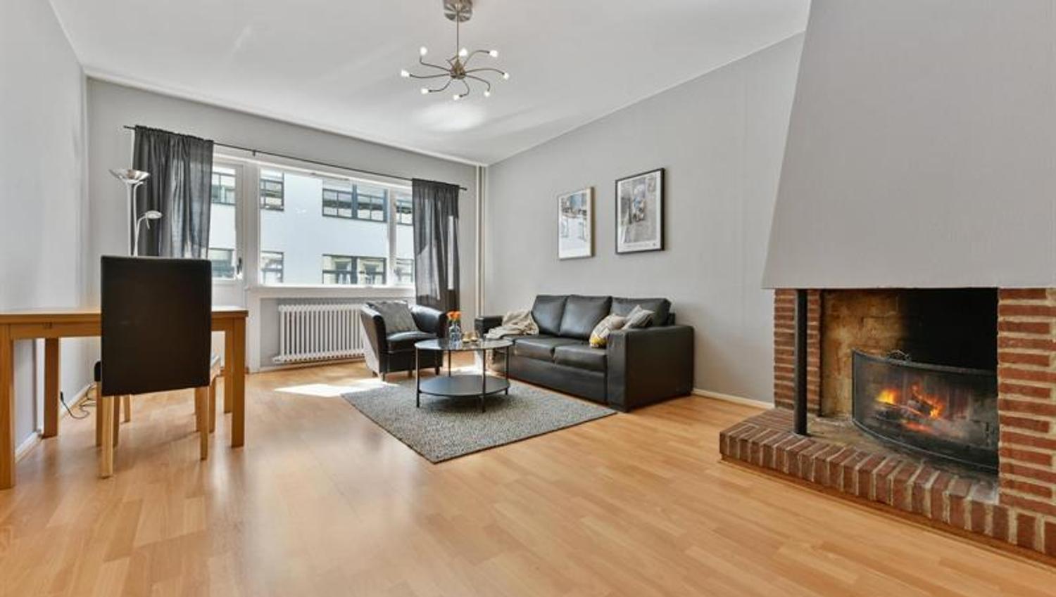 Living room, dining table and open fireplace