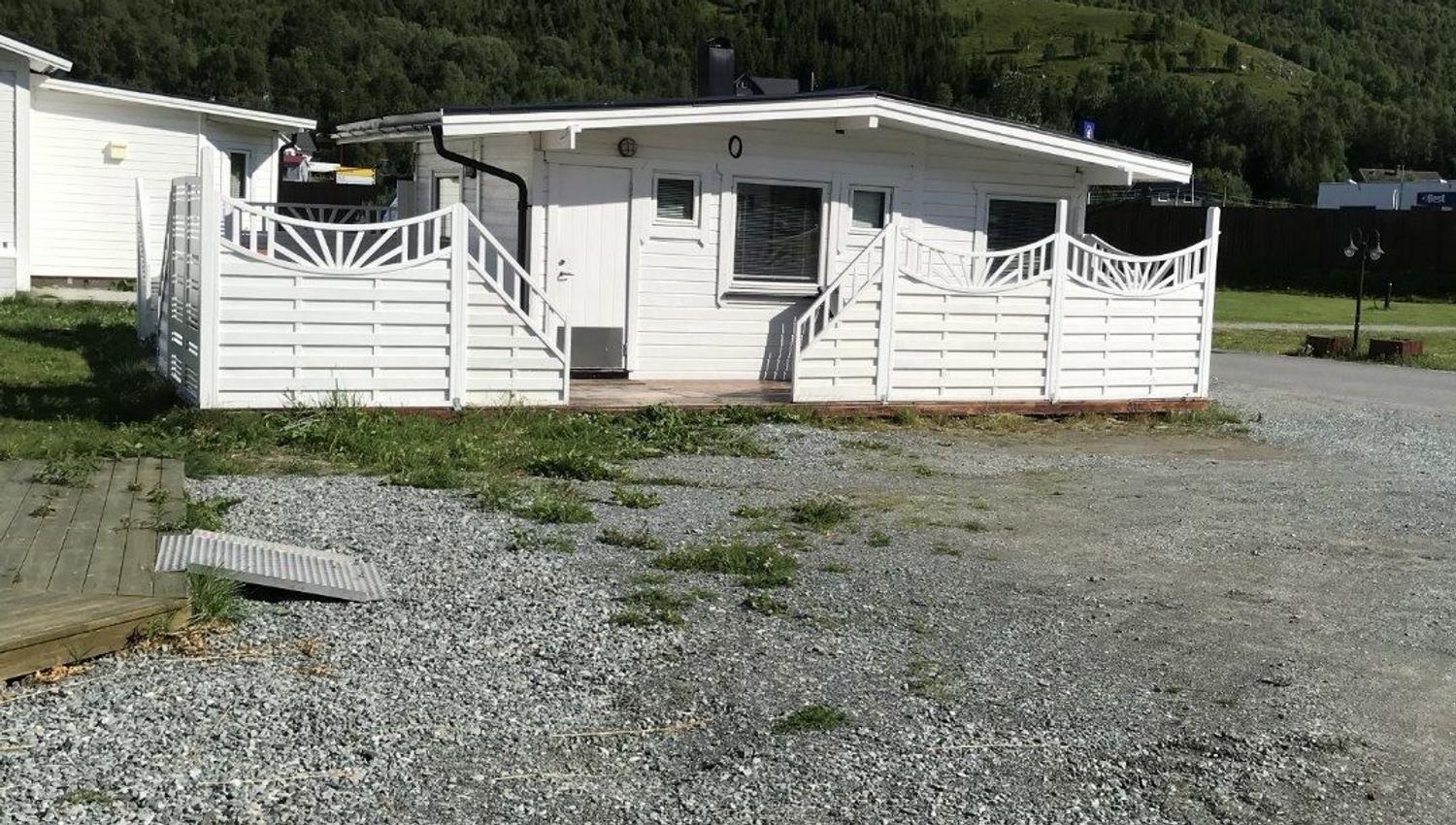 A white cabin at the camping
