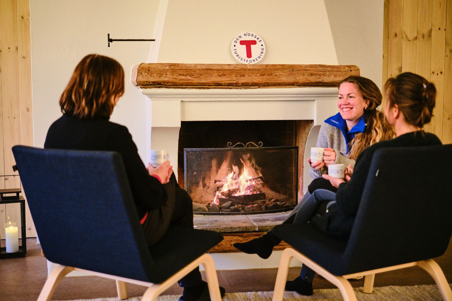 Gils in front of fireplace