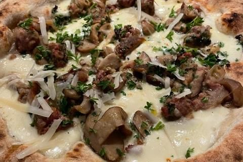 Detail of pizza with Salsiccia topping.