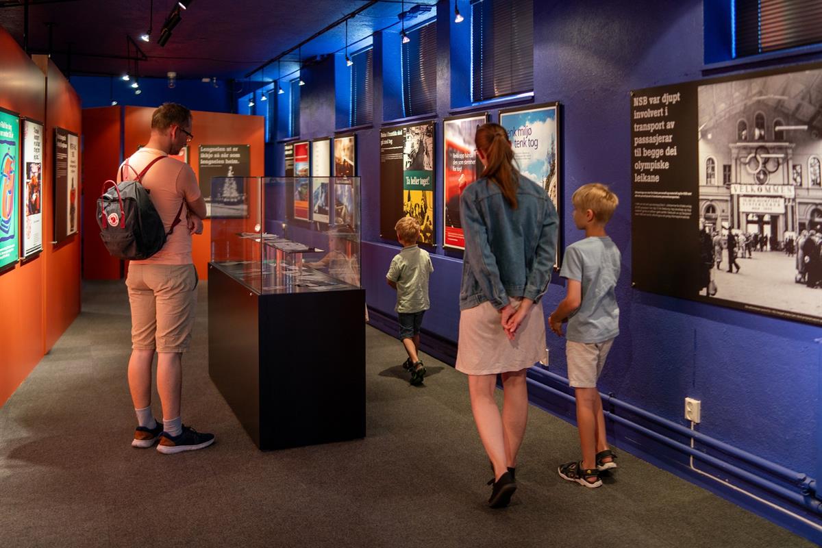 Visitors exploring interactive museum exhibits.