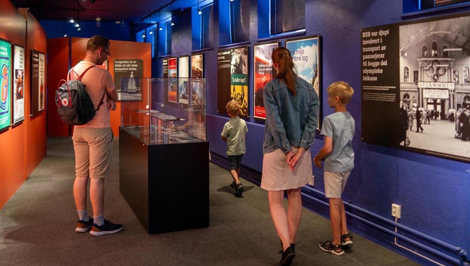 Visitors exploring interactive museum exhibits.