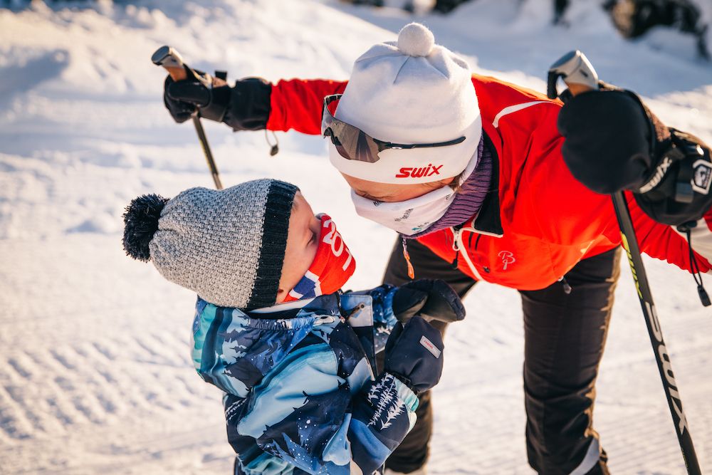 mother and son look at each other happily during the ski trip on Lifjell 