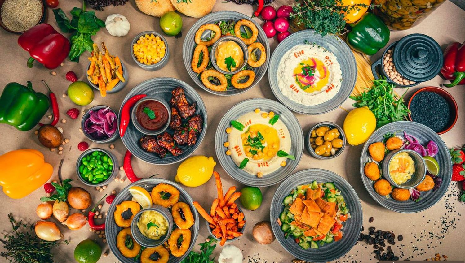 Colorful sharing plates and fresh ingredients ready to be served at Øvreviken Pizzeria.
