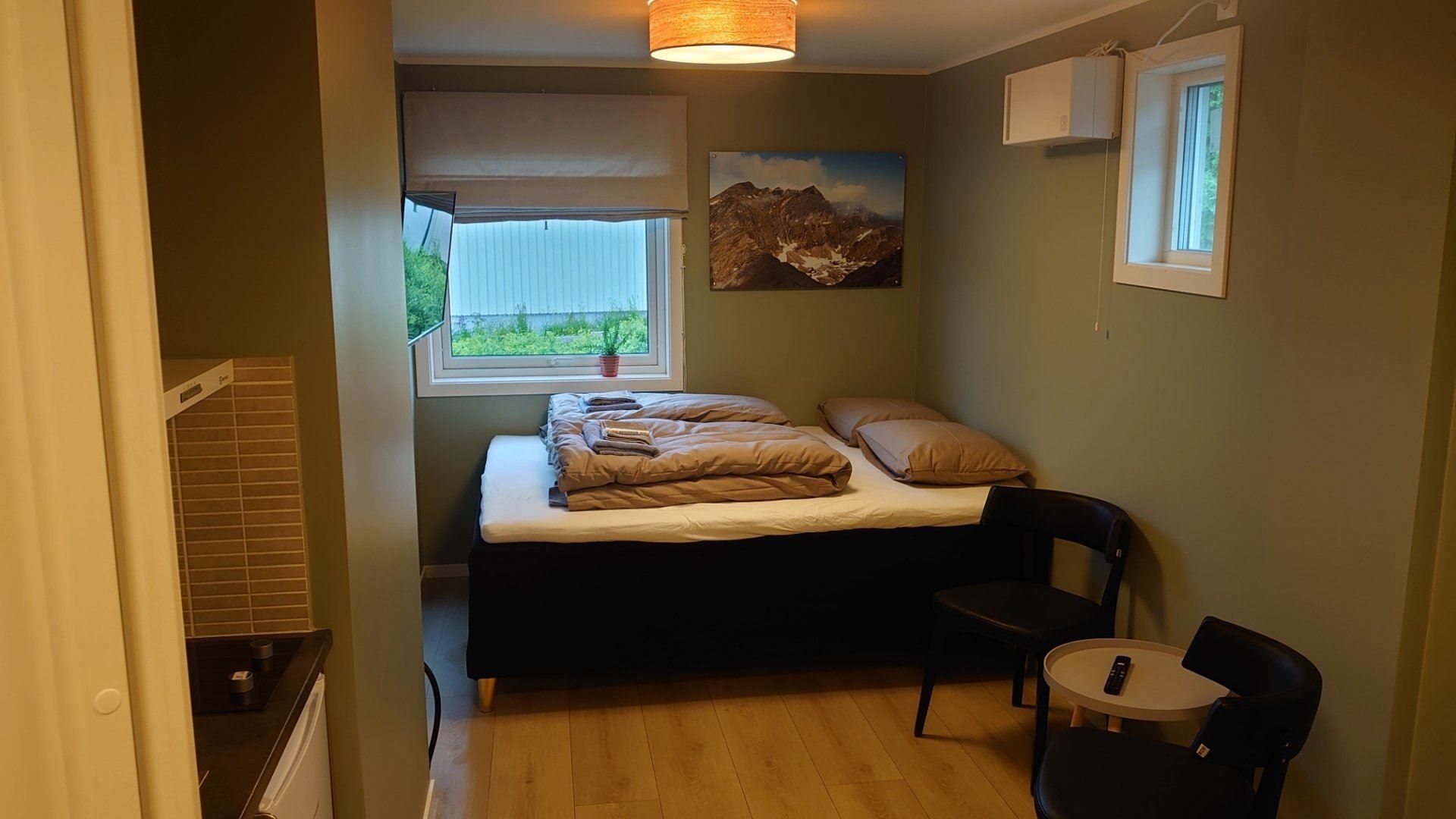 Doublebed in a corner of the room