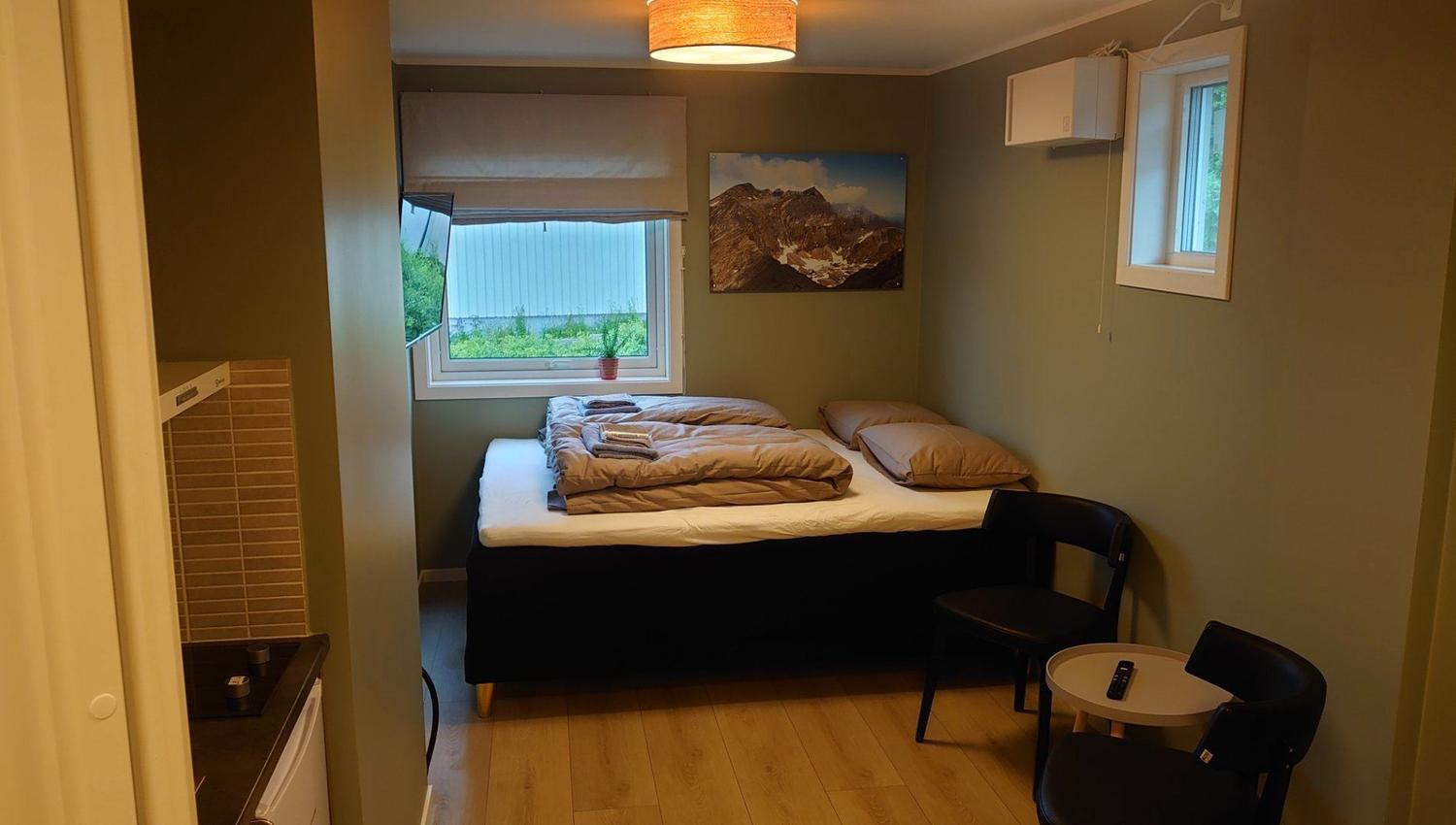 Doublebed in a corner of the room