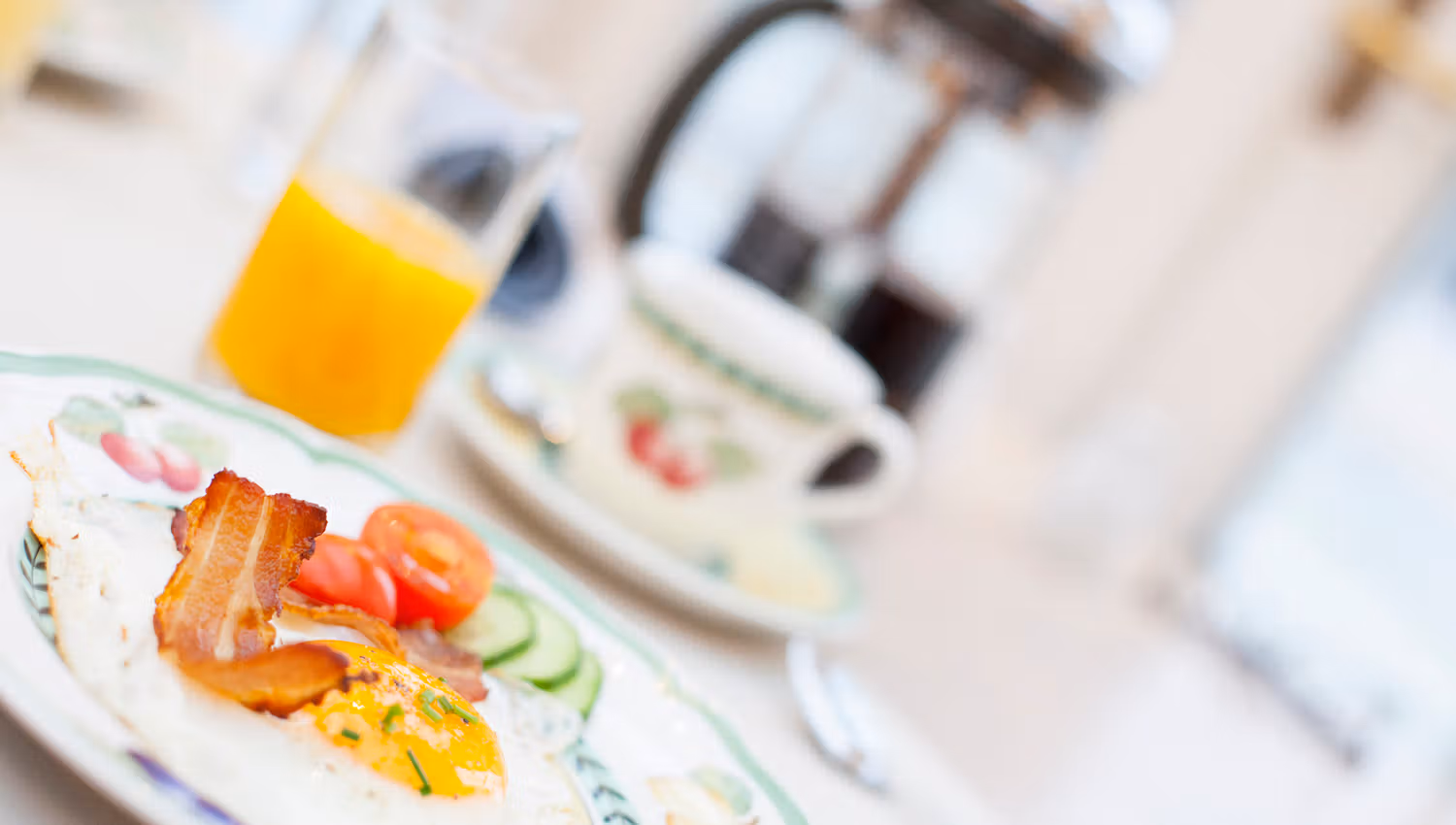 Breakfast on a plate and glass of juice