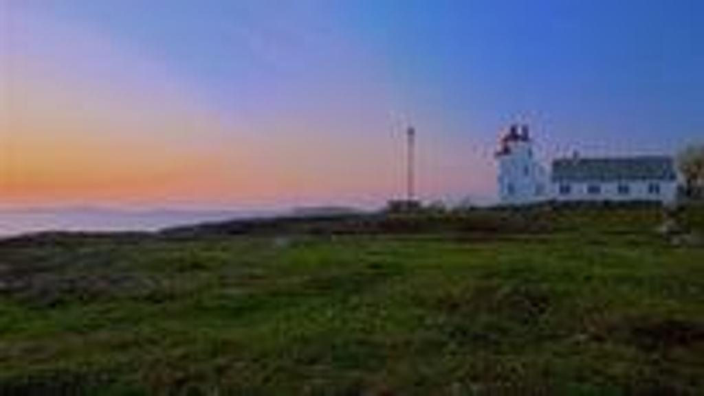 Tungenes Lighthouse by the sea 