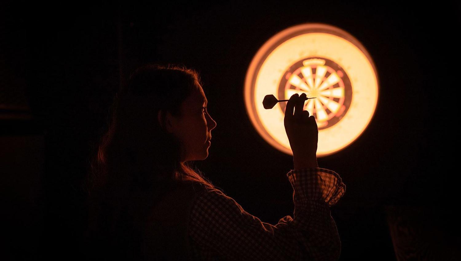 Guest playing darts at EPIC Tromsø.