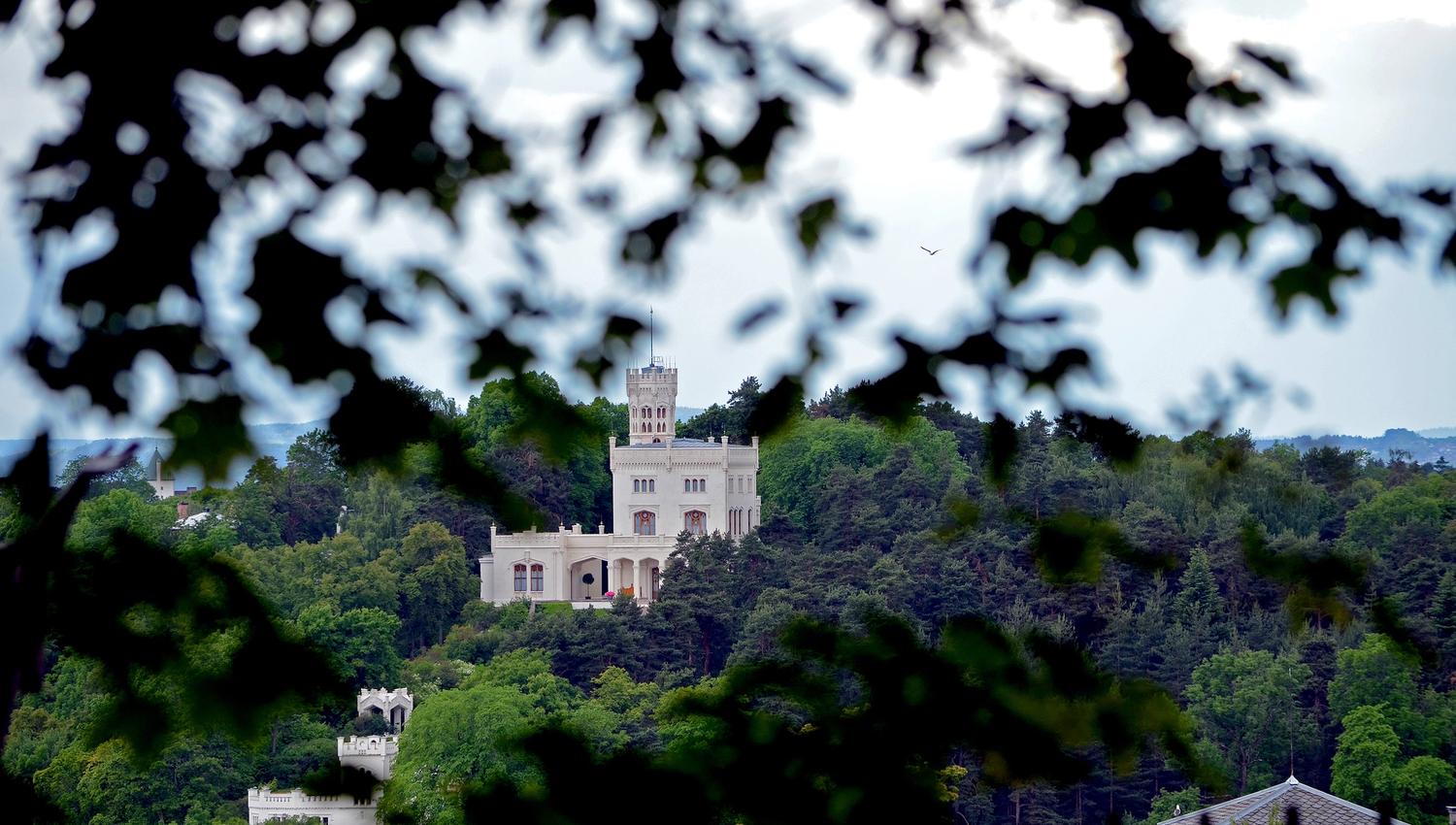 Oscarshall sticking out between the trees on Bygdøy, seen from Frogner borough