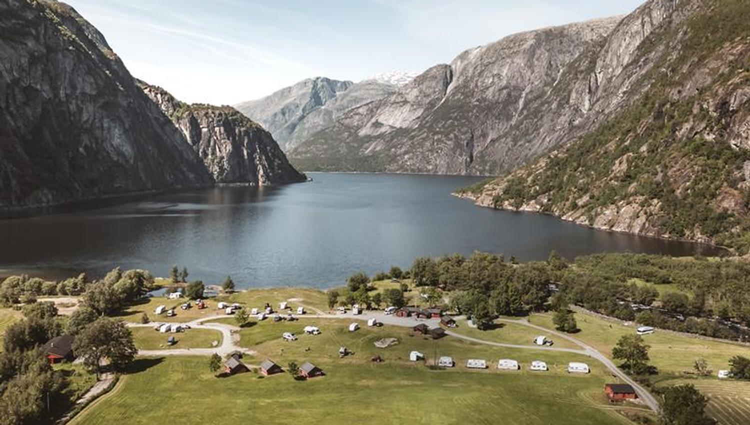 A drone photo of the campground, with the Eidfjord lake in the background.