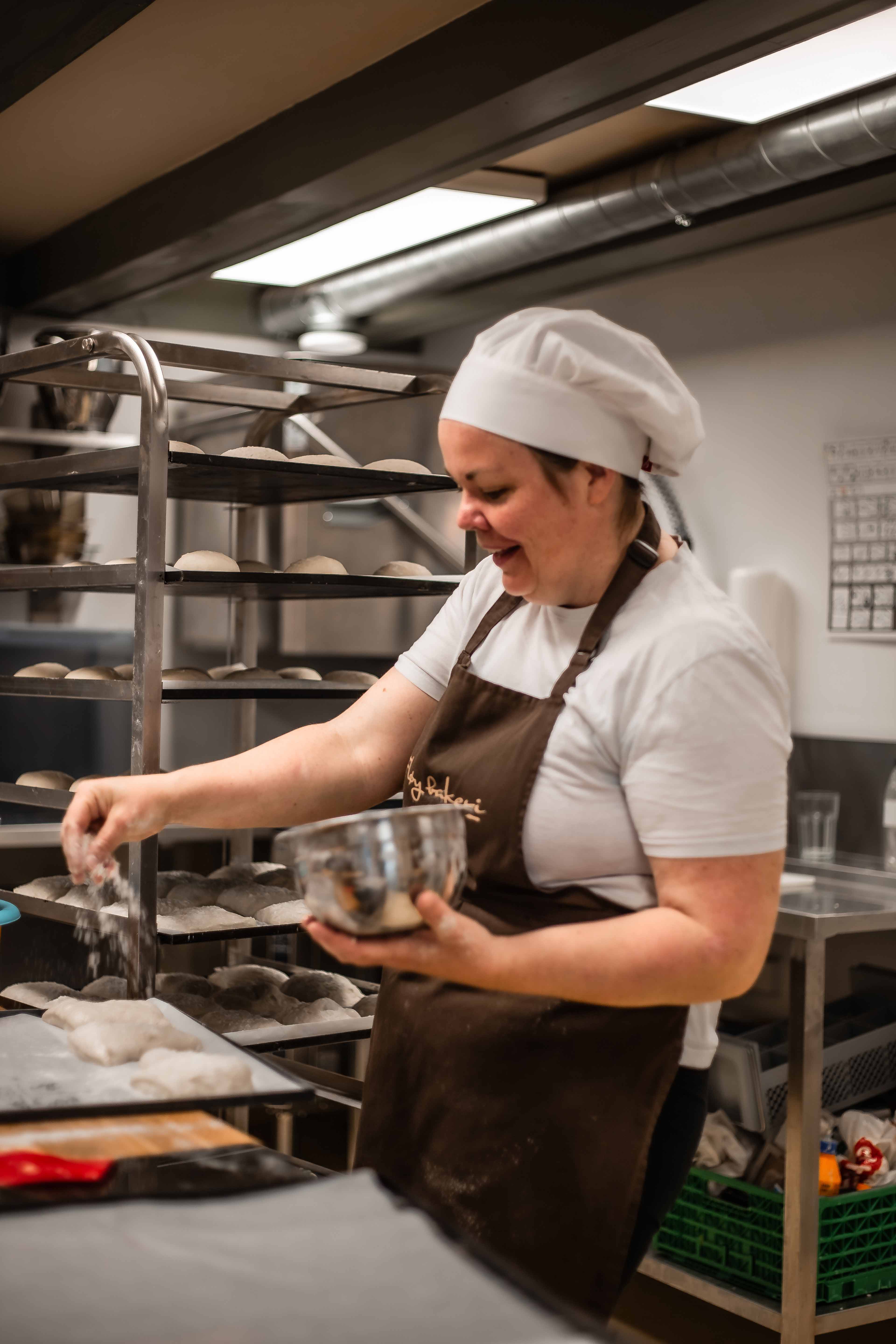 Baker making fresh buns at Fløy Bakery in Lofthus, Hardanger.
