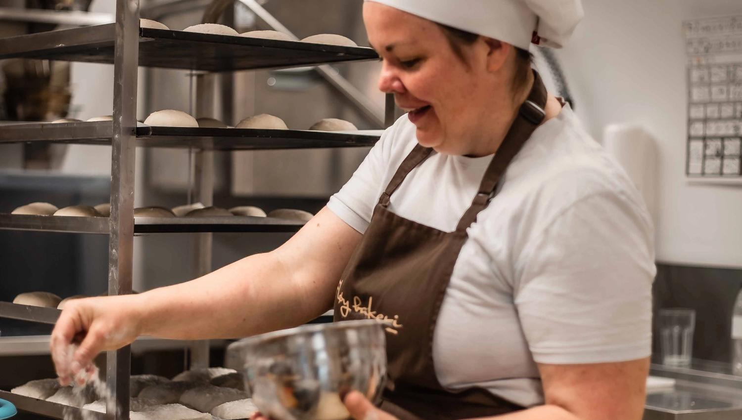 Baker making fresh buns at Fløy Bakery in Lofthus, Hardanger.