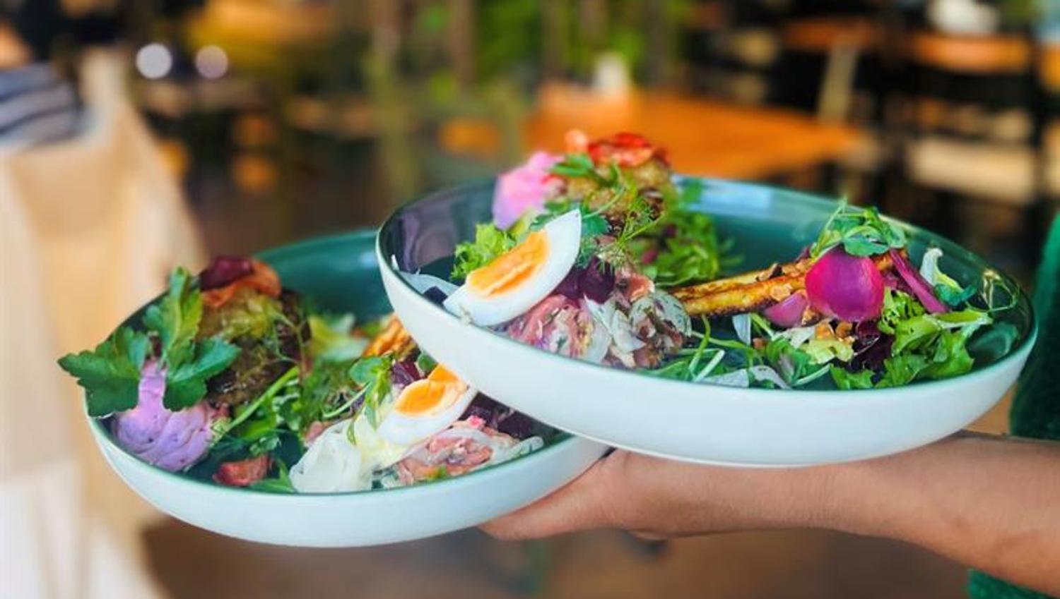 Detail of two bowls with salad