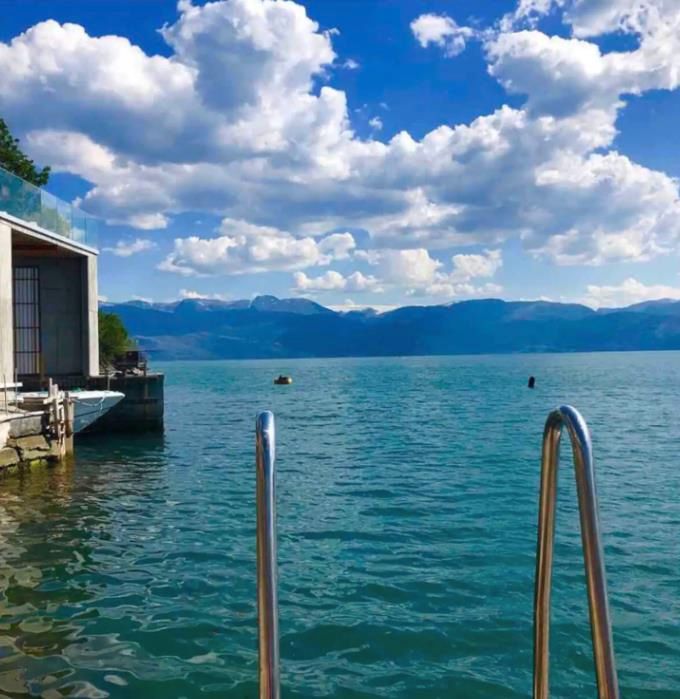 Private swimming spot with a ladder leading directly into the Hardangerfjord – perfect for a refreshing dip.