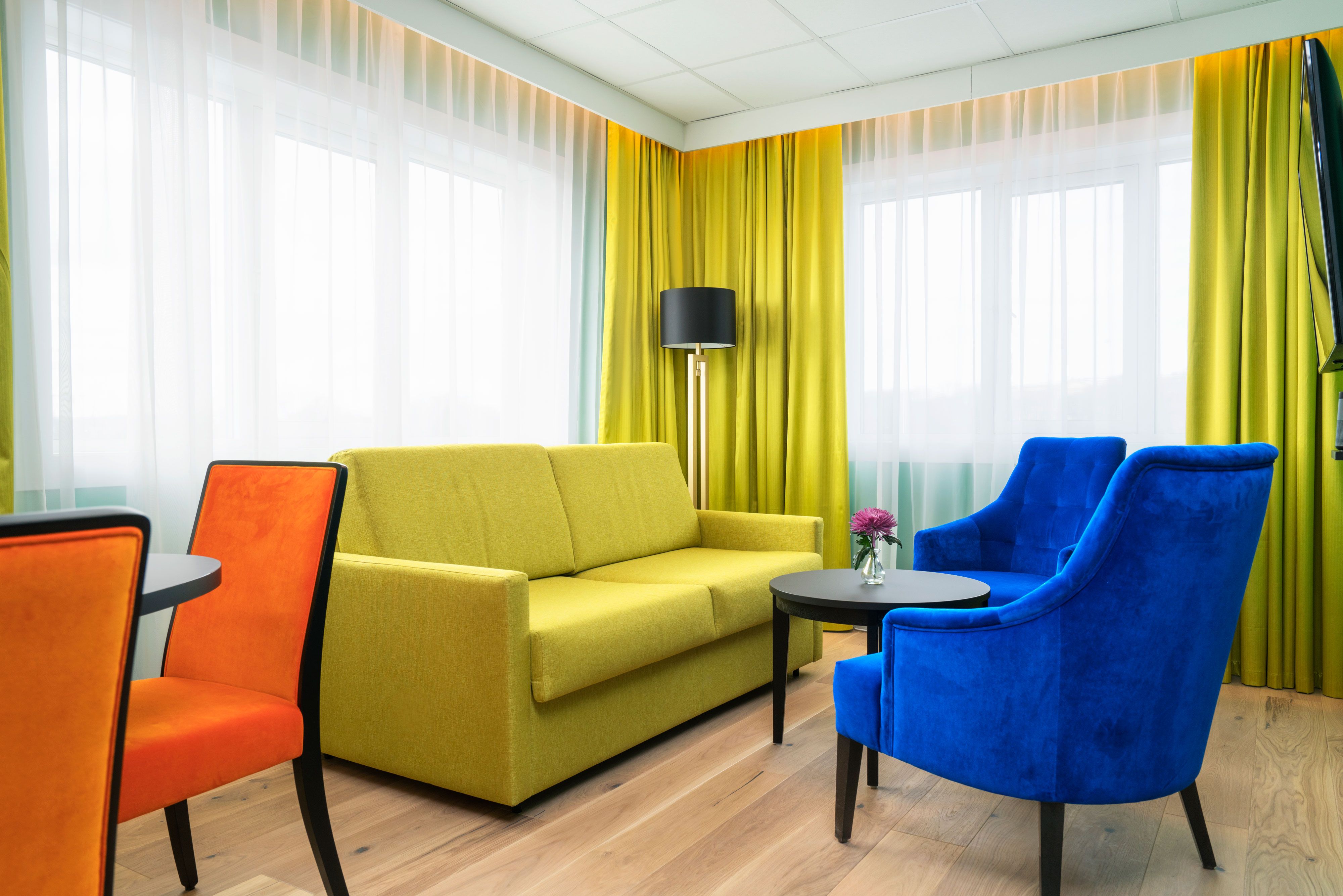 bright room with sofa and armchairs 