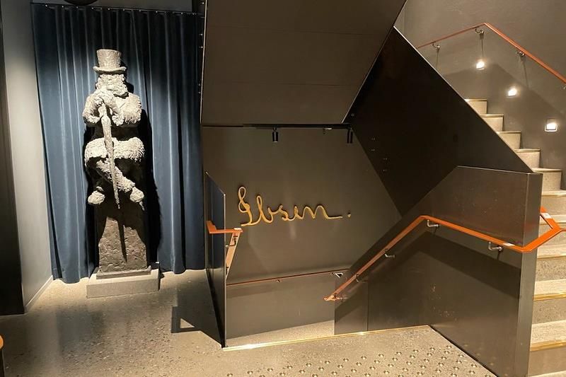 Stairwell at the museum, sculpture of Ibsen sitting down