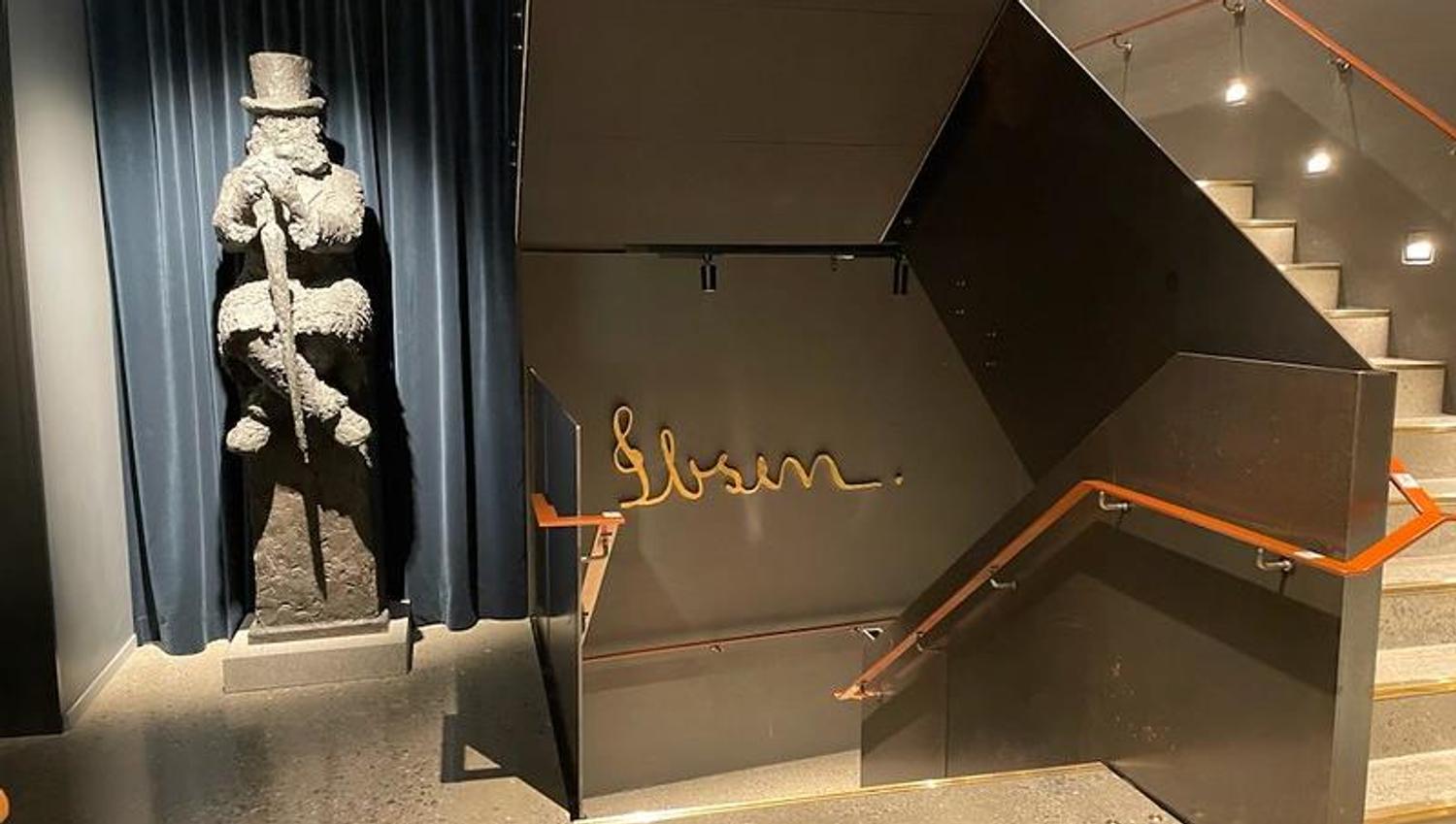 Stairwell at the museum, sculpture of Ibsen sitting down