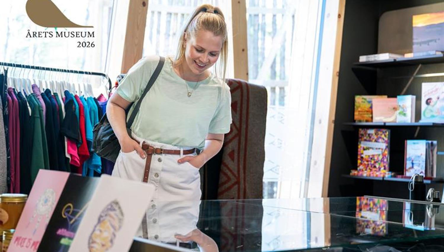 Lady checking out the museum shop