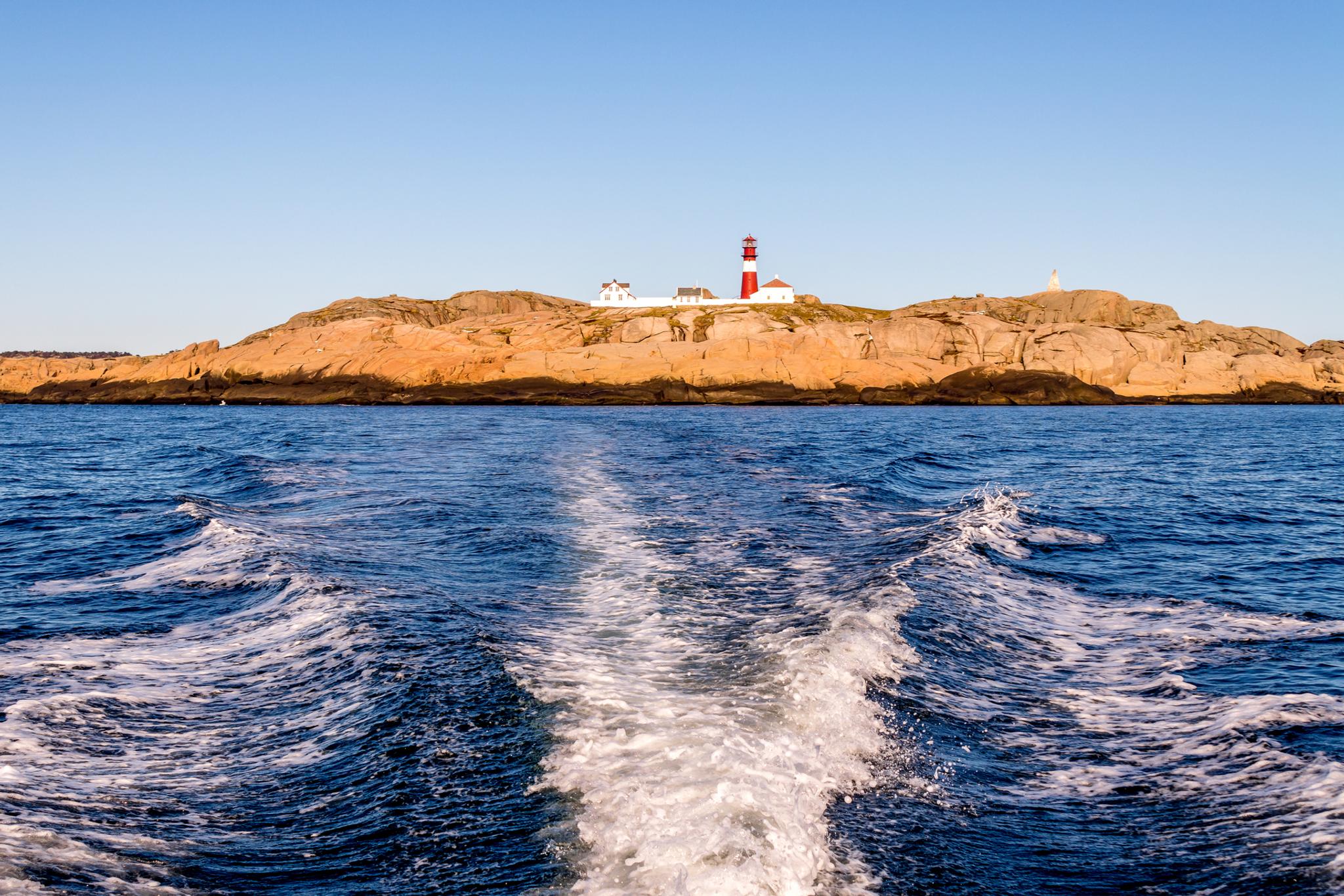 Ryvingen Lighthouse, seen from a boat at sea