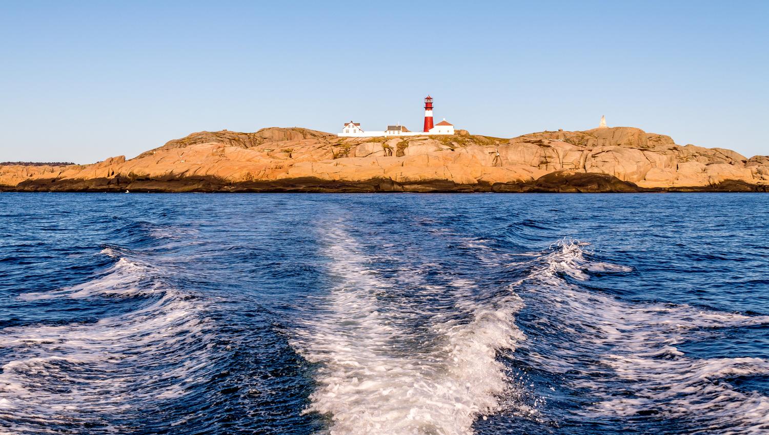 Ryvingen Lighthouse, seen from a boat at sea