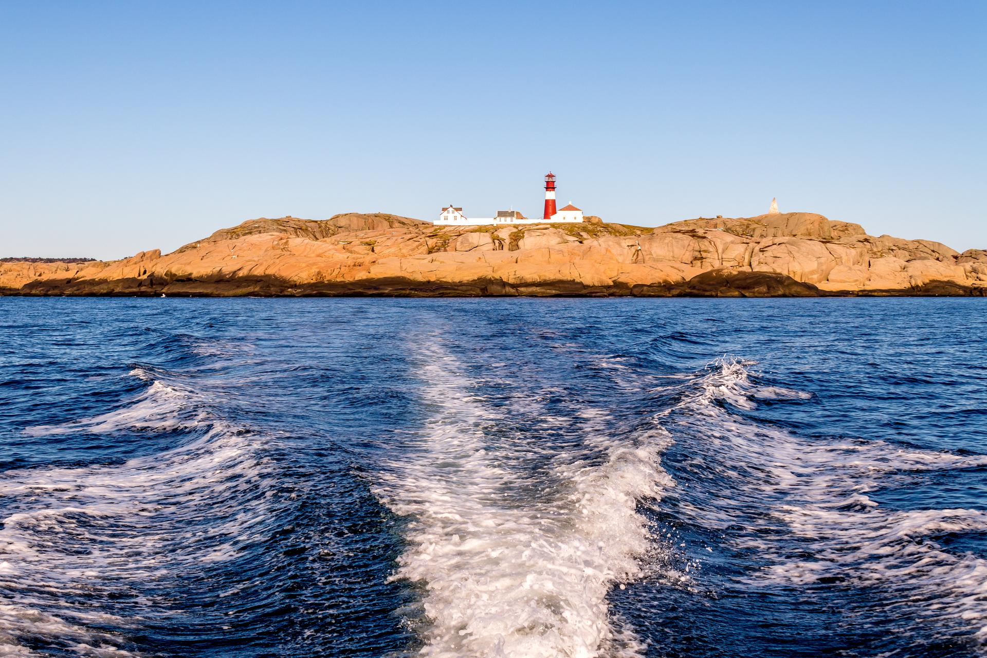 Ryvingen Lighthouse, seen from a boat at sea