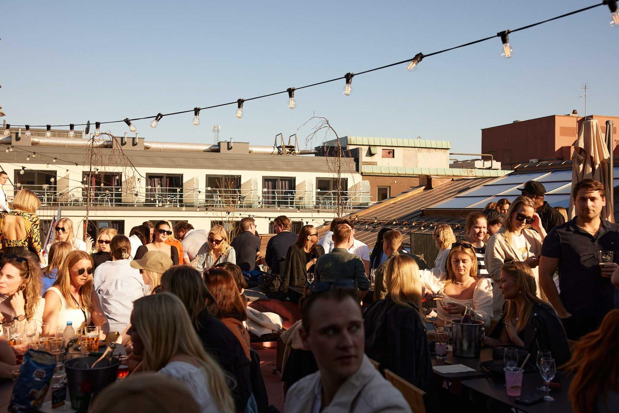 People drinking beer on the roof terrace