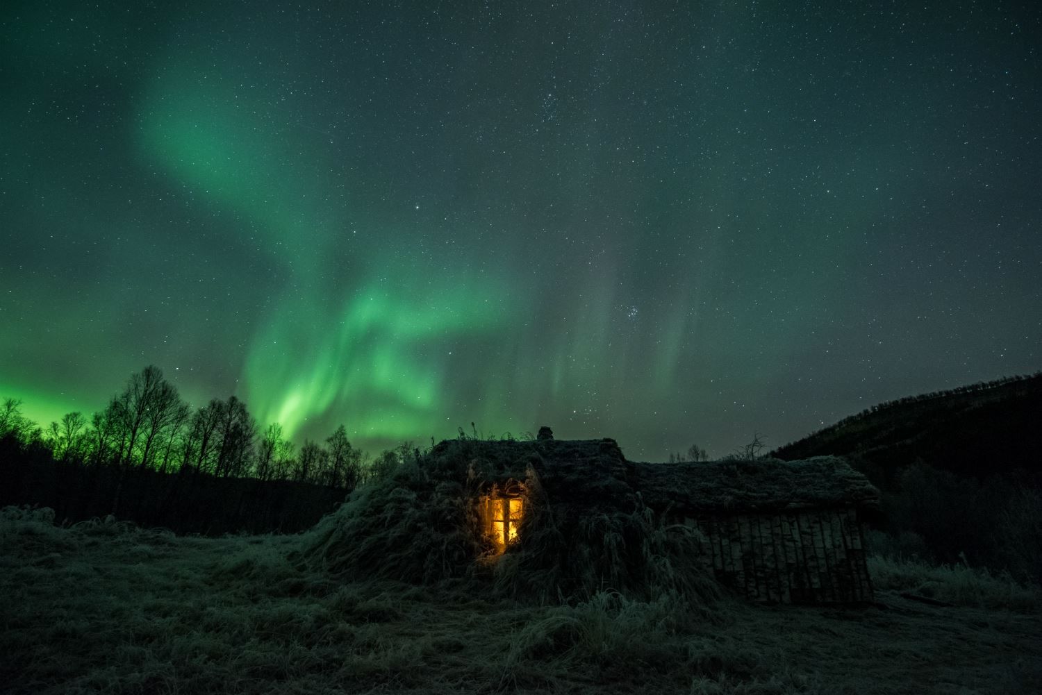 exterior of Viking building, with northern lights above