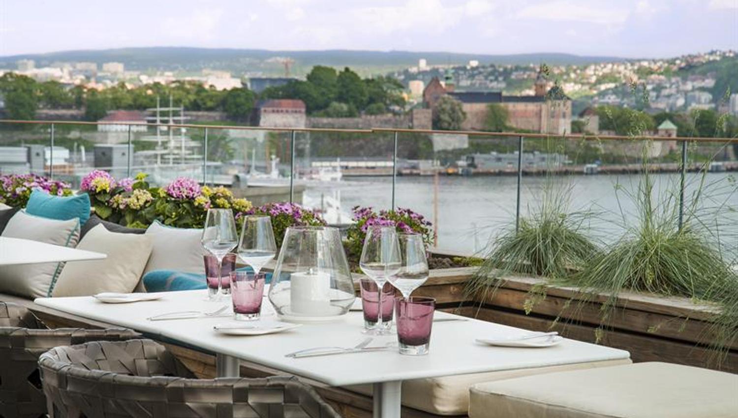 rooftop seating with views of the fjord and akerhus fortress