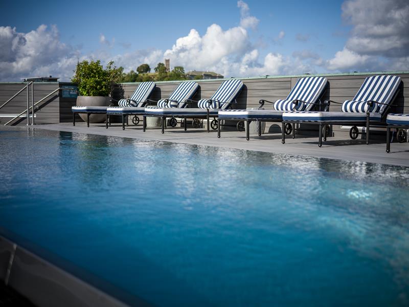 Pool with sunbeds