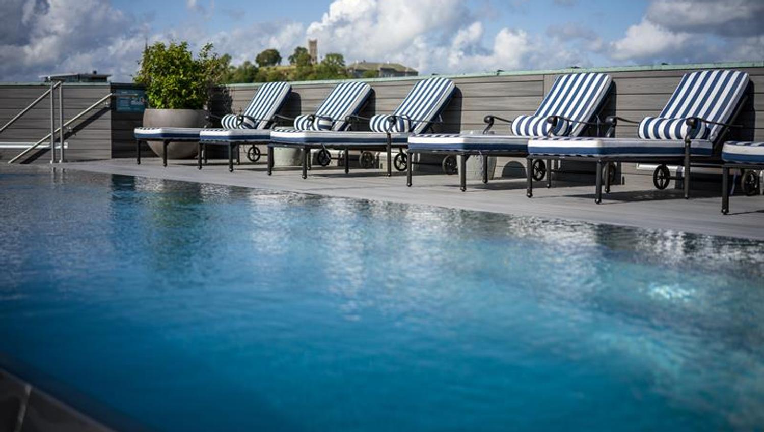 Pool with sunbeds