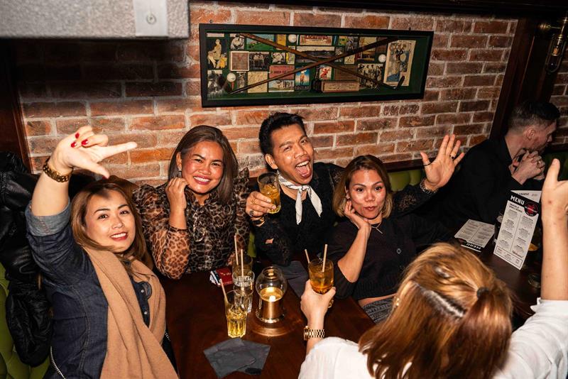 People enjoying themselves in a booth